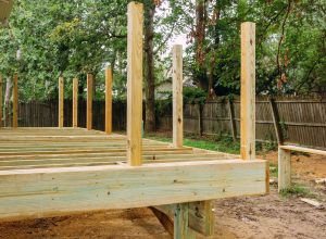 Installing wood floor for patio deck with new wooden decking fragment planks